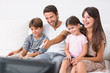 © WavebreakmediaMicro - Happy family watching television