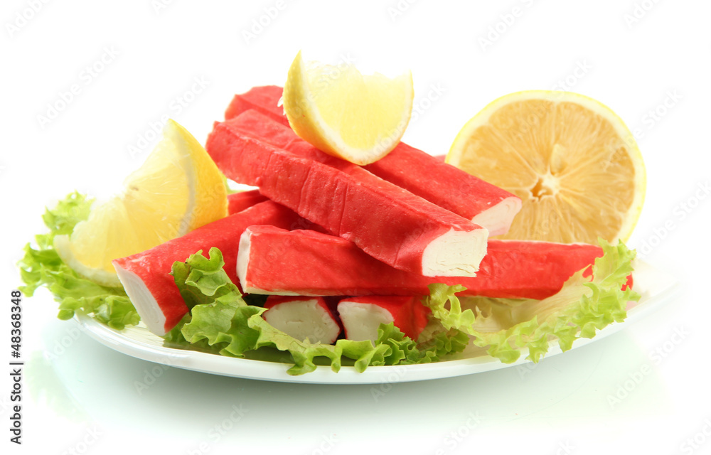 Crab sticks with lettuce leaves and lemon