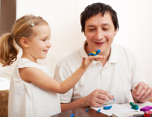 Wall Mural - Girl and dad molded from clay toys