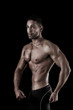 © Mauro Rodrigues - muscled man on a black background