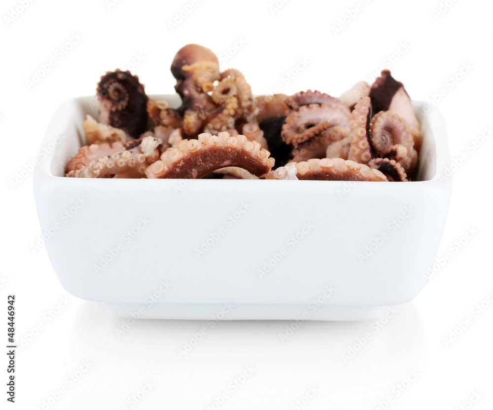 Tentacles of octopus in bowl isolated on white