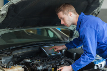 Poster - Mechanic using tablet pc
