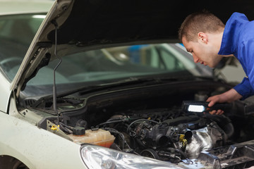 Poster - Mechanic repairing car engine
