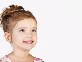 Wall Mural - Portrait of smiling cute little girl isolated