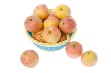 Basket full of apples isolated on white