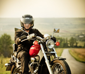 Fototapete - Biker on the country road