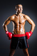 © Elnur - Boxer with red gloves in dark room