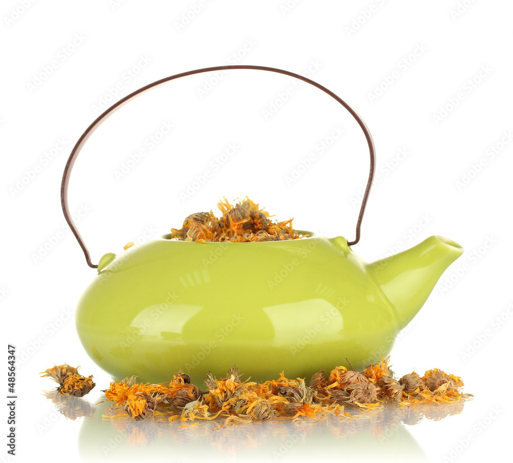 Dried herbs in teapot, isolated