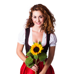 Wall Mural - junge brünette Frau im Dirndl mit Sonnenblume