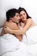 © auremar - couple sleeping together in bed