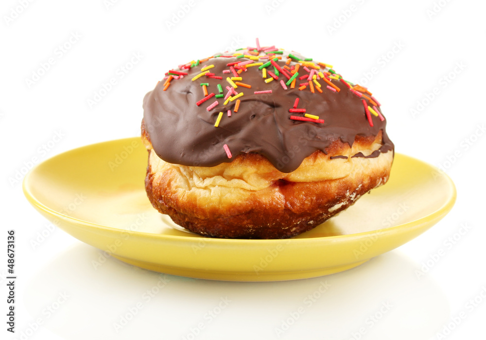Tasty donut on color plate isolated on white