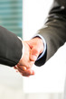 © Kzenon - Business people doing Handshake