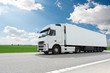 canvas print picture - white lorry with trailer over blue sky