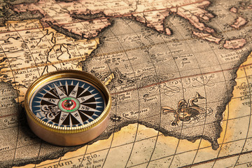 Vintage compass and old map