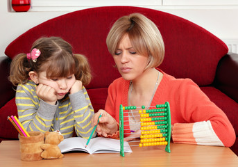 Wall Mural - unhappy daughter and mother doing homework