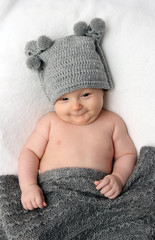 Baby in gray hat