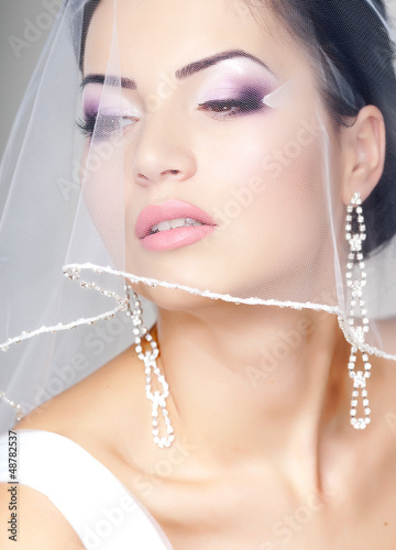 Naklejka nad blat kuchenny bride portrait with veil over her face, professional make-up