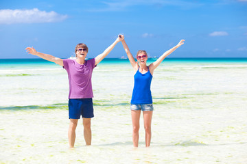 happy young couple having fun on the beach