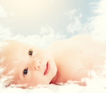 Newborn Baby In The Clouds In The Sky