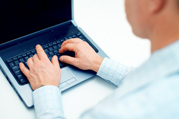 Poster - Image of businessman working on laptop