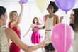 © JGI/Jamie Grill/Blend Images - Women playing with balloons at party