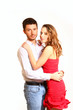 © majesticca - Portrait of young couple hugging isolated on white background