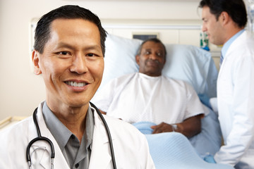 Wall Mural - Portrait Of Doctor With Patient In Background