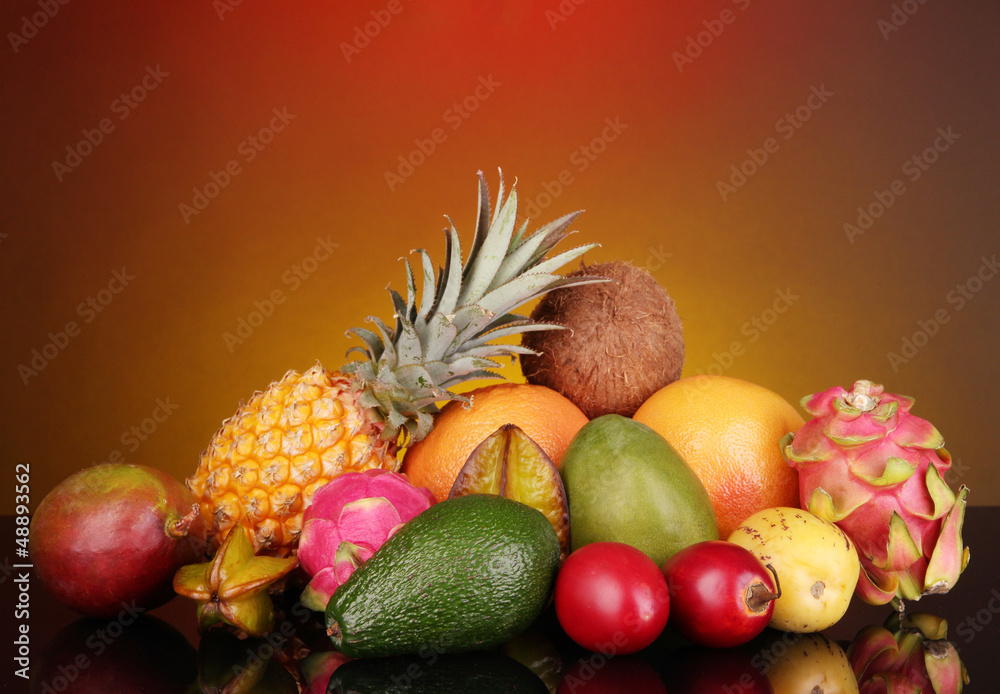 Composition of exotic fruits on colorful background