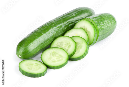 Cuadros en Lienzo Cucumber and slices isolated over white background