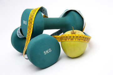 dumbbells, apple and measure tape