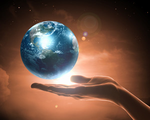 Wall Mural - Image of earth planet on hand