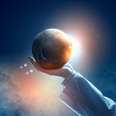 Wall Mural - Image of earth planet on hand