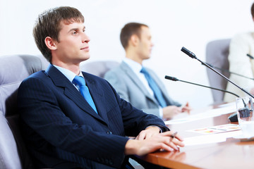 Three businesspeople at meeting