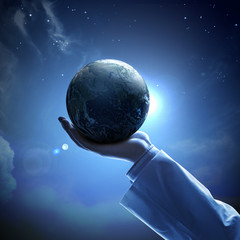 Wall Mural - image of earth planet on hand