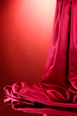 Wall Mural - Silk fabric, on red background