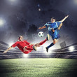 © Sergey Nivens - two football players striking the ball