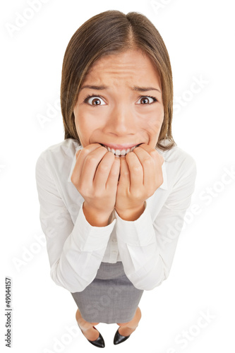 Fotografía Frightened and stressed young business woman