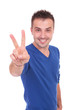 © Viorel Sima - young casual man making victory sign