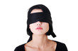 Portrait of the young woman blindfold