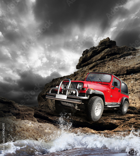 Naklejka - mata magnetyczna na lodówkę Offroad vehicle on the mountain terrain