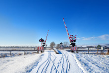 Railway Crossing In Winter