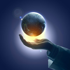Wall Mural - image of earth planet on hand