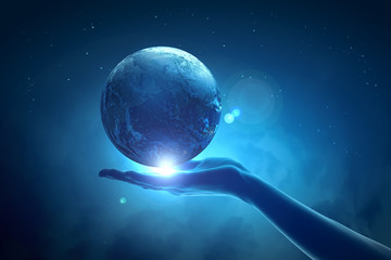 Wall Mural - image of earth planet on hand