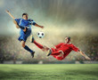 © Sergey Nivens - two football players striking the ball