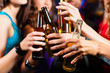 © Kzenon - People drinking beer in bar or club