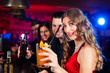 © Kzenon - People with cocktails in bar or club