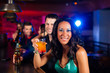 © Kzenon - People with cocktails in bar or club