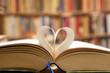 © Yü Lan - Book page in heart shape with library background