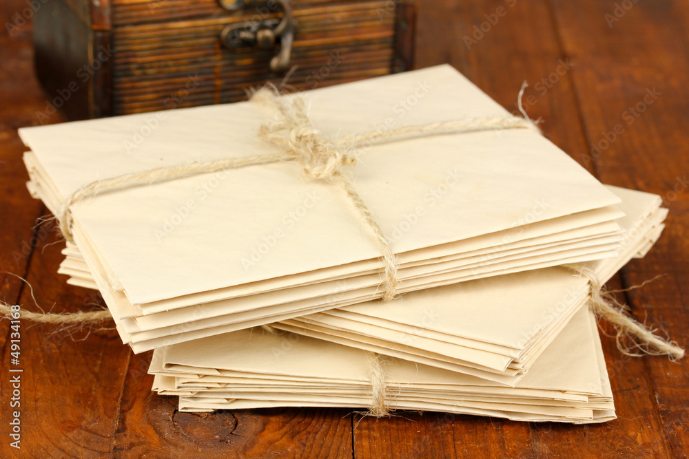 Stacks of old letters on wooden table