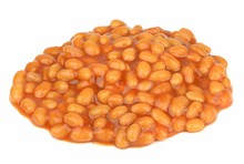 A Pile Of Baked Beans In Tomato Sauce On A White Background